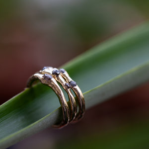 Raw gold ring with 3 rough diamonds