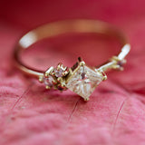 Princess cut diamond and pink sapphires cluster ring