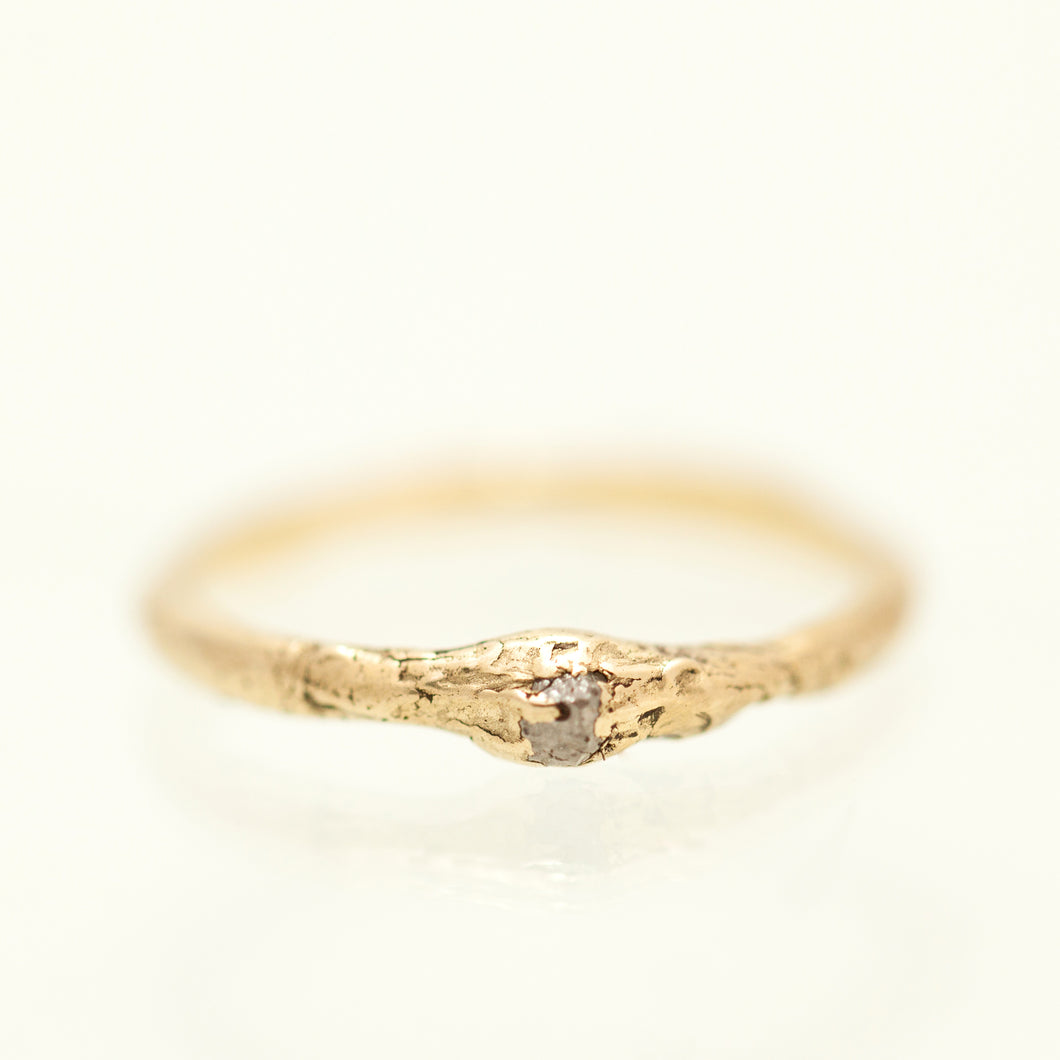 Raw gold ring with raw diamond
