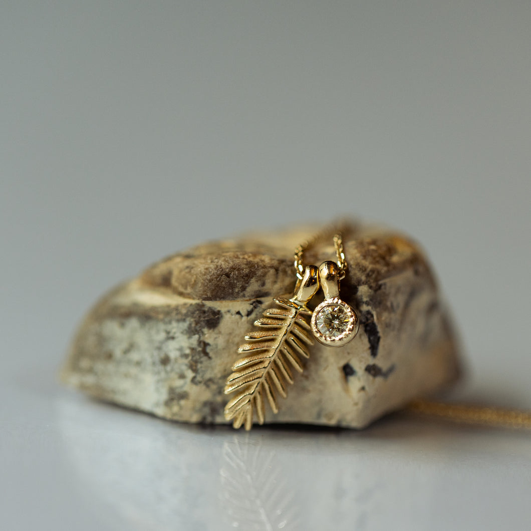 Palm tree leaf pendant with champagne diamond