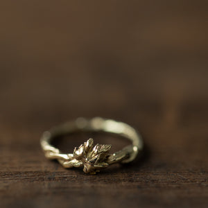Twisted branch ring with vine leaf