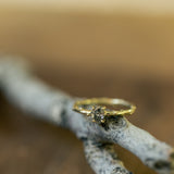 Solitaire branch ring with oval grey diamond