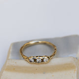 Raw pod ring with white diamonds