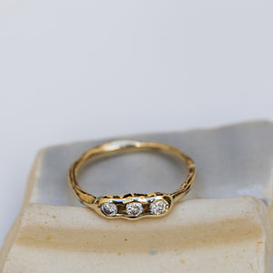 Raw pod ring with white diamonds