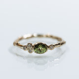 Asymmetric branch ring with green sapphire and diamonds