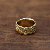 Wide cracked bark gold ring