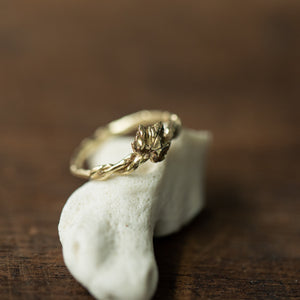 Twisted branch ring with vine leaf