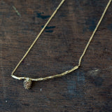 Branch necklace with delicate pinecone