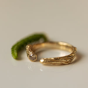 Open branch ring with champagne diamond