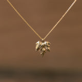 Vine leaf gold pendant