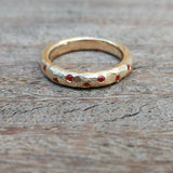Scattered ruby gold ring