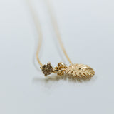 Delicate leaf pendant with champagne diamond