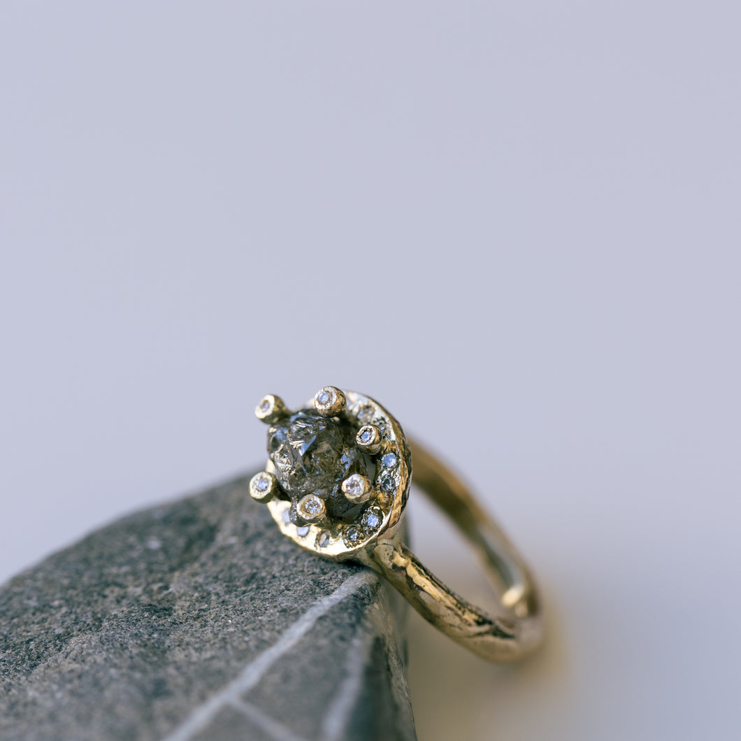 Raw space ring with raw diamonds