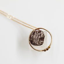 Load image into Gallery viewer, Meteorite in a round pendant
