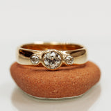 Thick tri-stone diamond ring