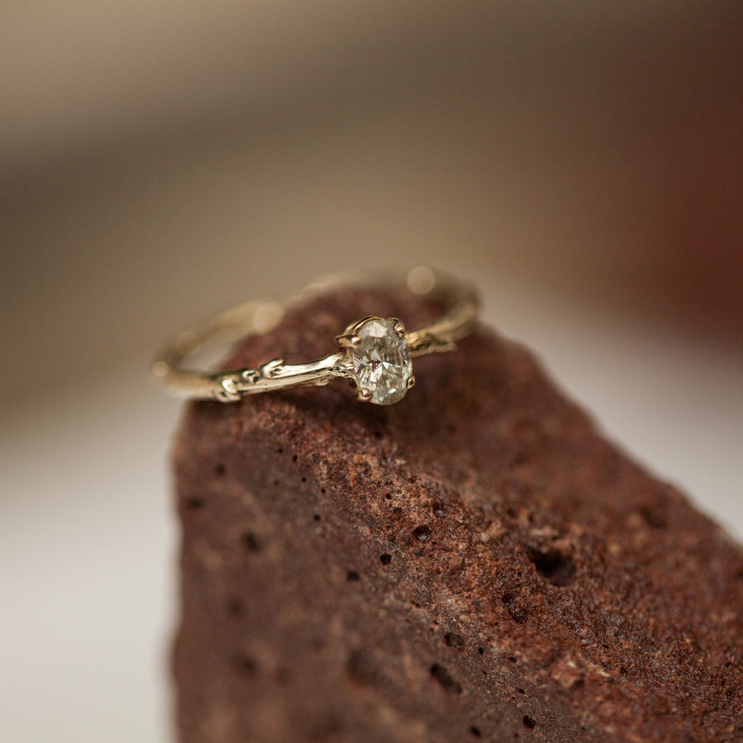 Oval branch engagement ring