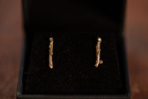 Short branch earrings set with diamonds